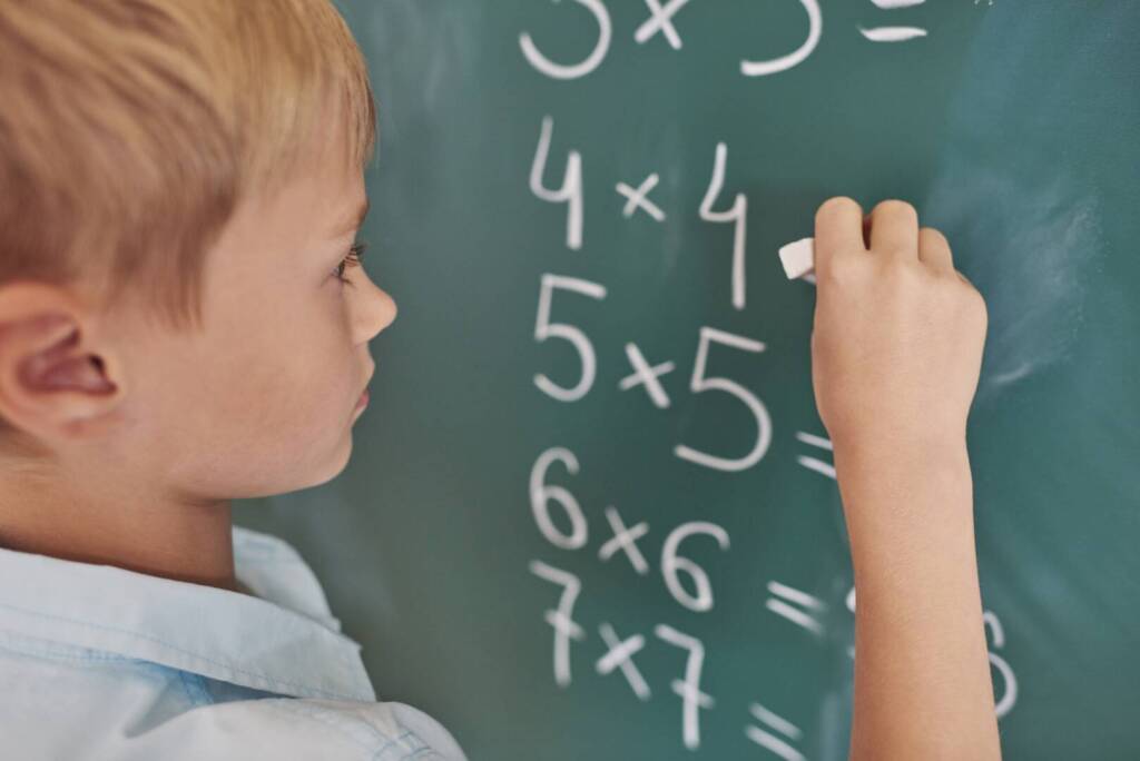 Boy doing some mathematical exercises